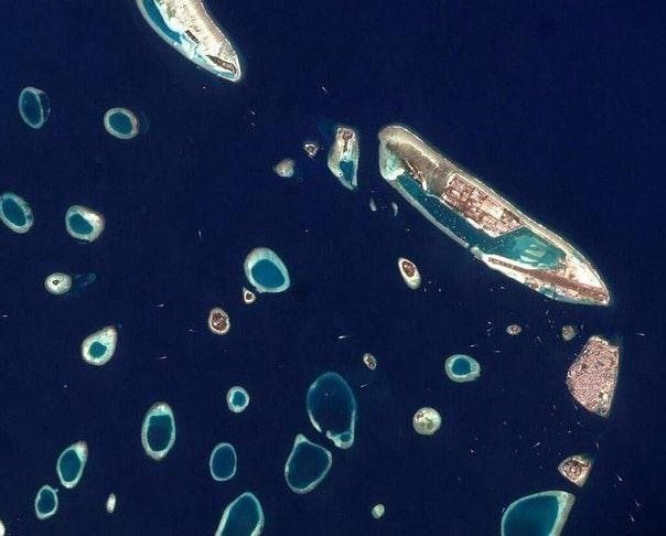 Maldives Capital City Seen from Space

The image shows the densely built island on the right, which is the capital of the Maldives.